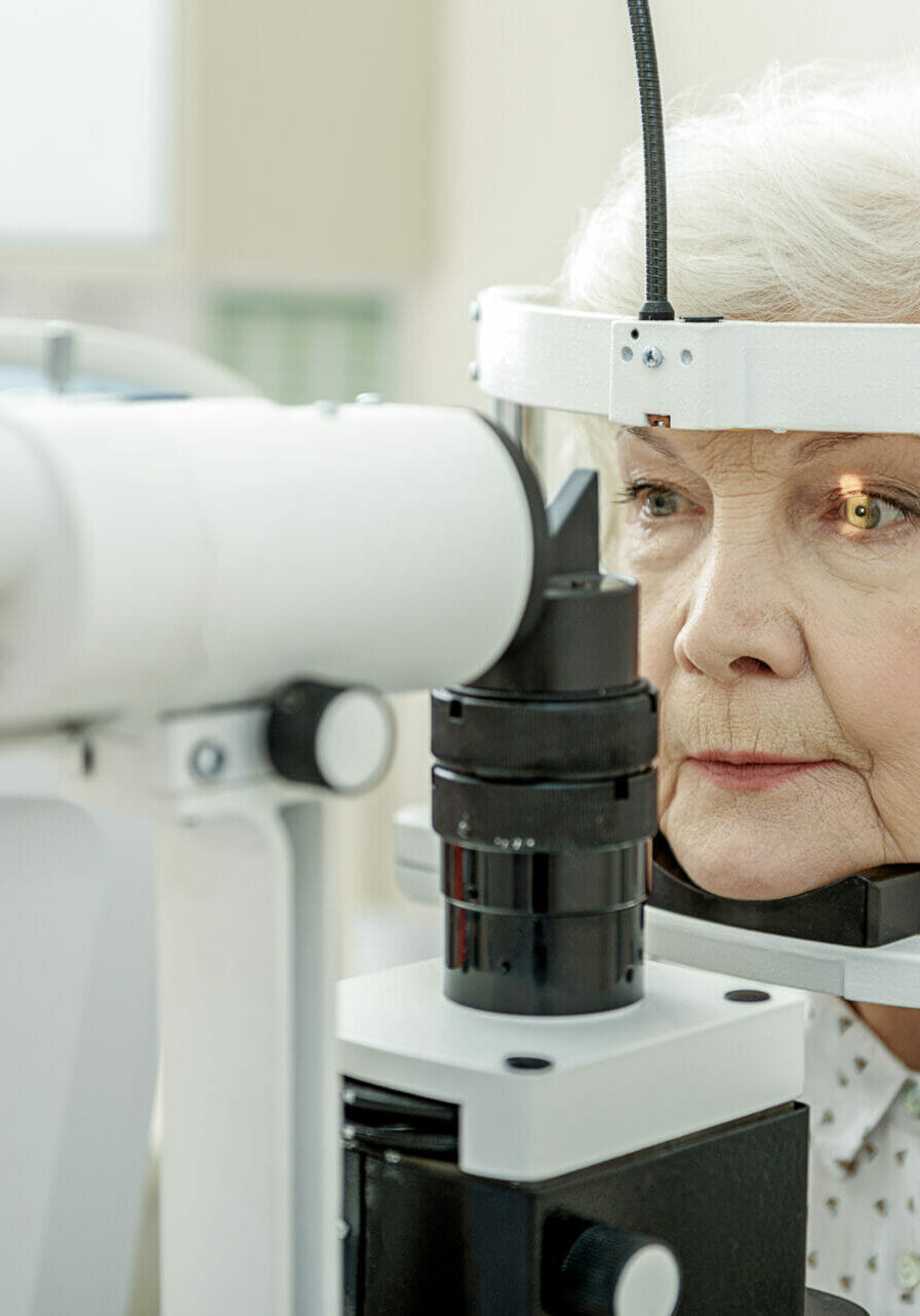 Young,Female,Ophthalmologist,Using,Apparatus